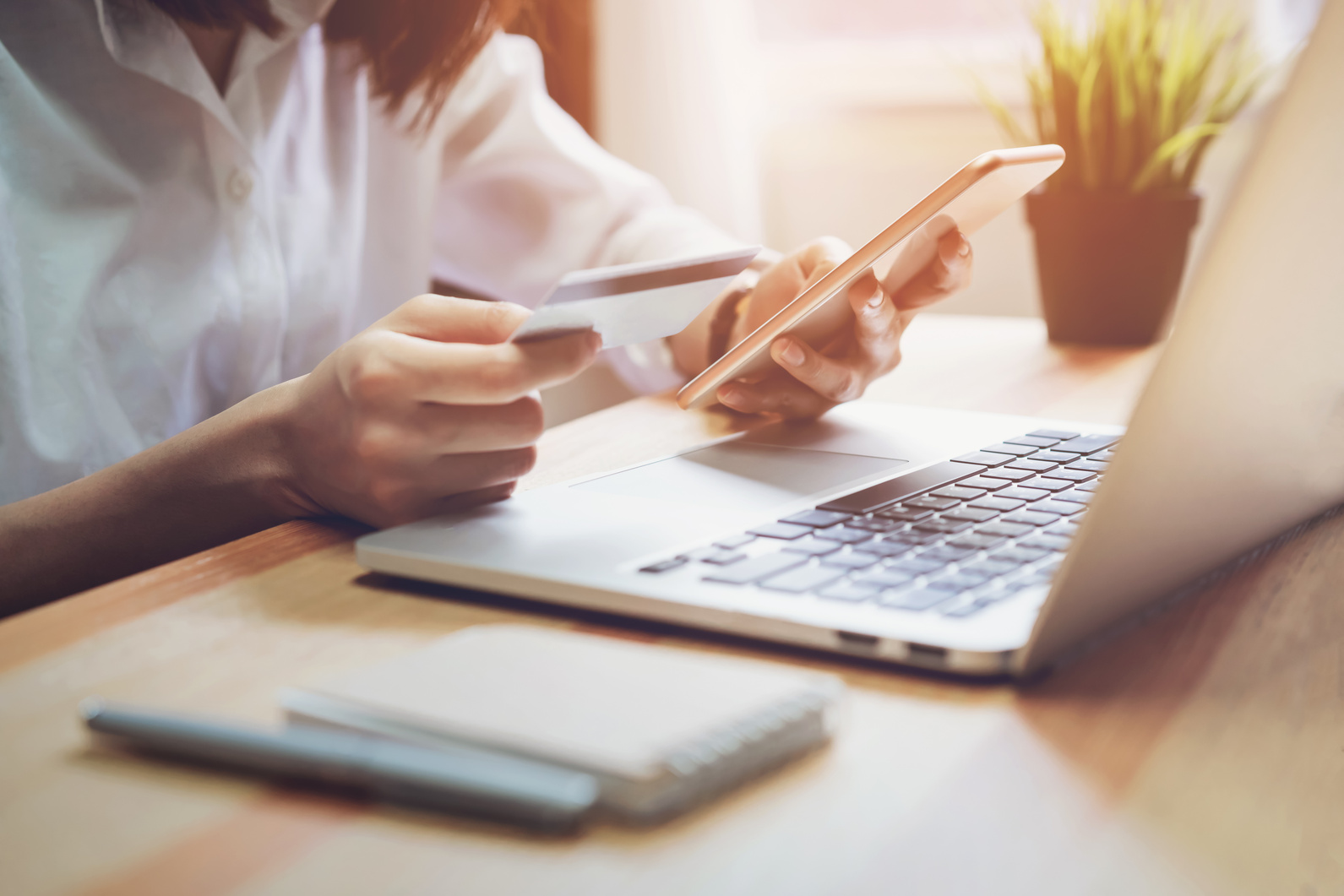 Woman holding credit card pay online and using smartphone for shop through the website. Concepts online shopping for convenience.